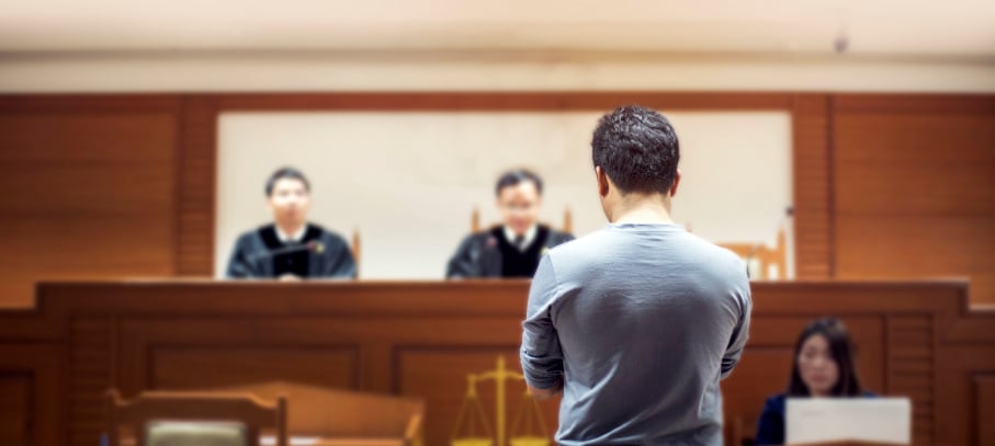 KoppPracticeAreas-Man-Standing-before-the-a-judge-at-the-court_03